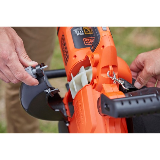 Close-up photo of BLACKDECKER BCBLV36B cordless leaf blower detail showing assembly of the black nozzle attachment.