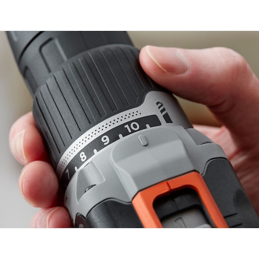 Close-up of BLACKDECKER cordless drill BCD003C1, showing grip, torque settings, and orange accent detail.