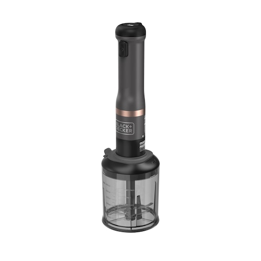 A BLACK+DECKER hand blender with a black handle and transparent mixing container. The container has measurement markings and contains blades for blending or chopping.