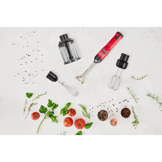 BLACKDECKER BCKM1014KR hand blender set with accessories and fresh vegetables, herbs, and spices on white background, top view.