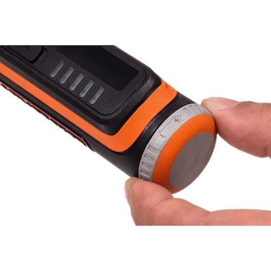 BLACKDECKER BCRT8IK photography of rotary control knob on black and orange tool held by fingers, close-up angle