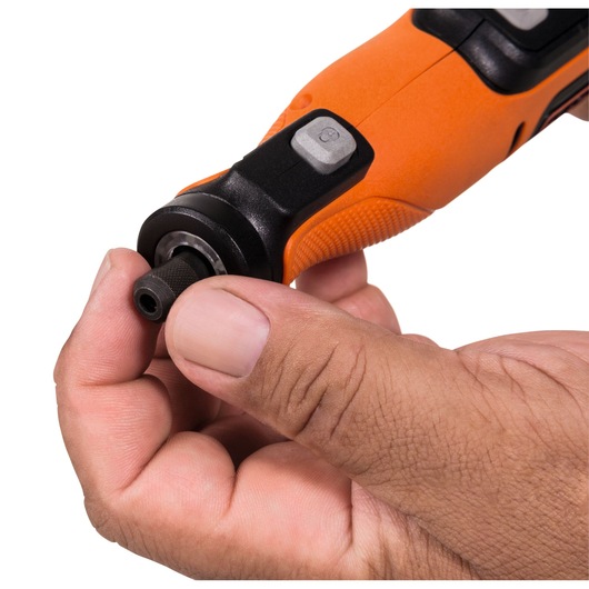 BLACKDECKER BCRT8IK rotary tool close-up, orange and black, being adjusted by hand, side angle.
