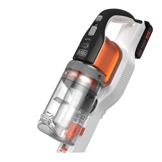 Close-up view of a BLACK+DECKER cordless handheld vacuum cleaner with a transparent dust container and orange filter, featuring control buttons on the handle.