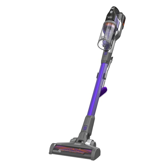 A BLACK+DECKER cordless stick vacuum cleaner with a purple and grey design, featuring a transparent dust container and a motorized brush head.