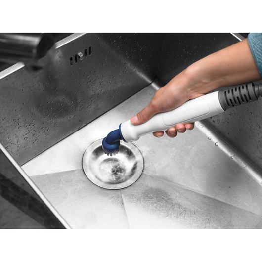 BLACK+DECKER BHSM1615DSM handheld scrubber cleaning stainless steel sink drain.