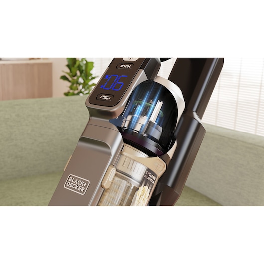 Photo of BLACK+DECKER BSV520BLP cordless vacuum close-up, showing digital display and cyclone filter in a home setting.