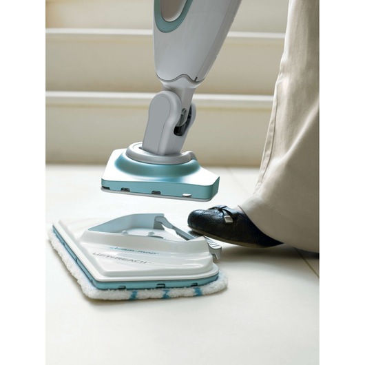 BLACKDECKER FSM1616 steam mop with detachable pad, close-up side angle on white floor.
