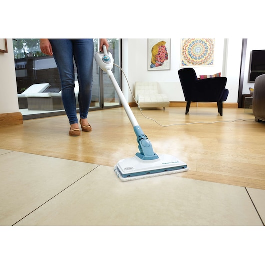 BLACKDECKER steam mop FSMH1300FX cleaning a floor in a modern living room, front angle.