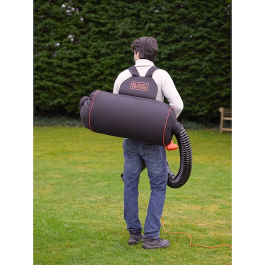 BLACKDECKER GWBP1 backpack leaf blower with black bag and orange accents, outdoor use.