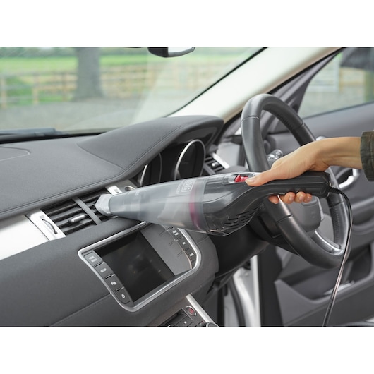 BLACKDECKER NVB12AVA handheld vacuum cleaning car dashboard air vent.