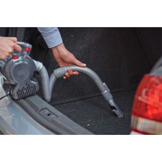 BLACK+DECKER PD1200AV handheld vacuum cleaning car trunk carpet with flexible hose.